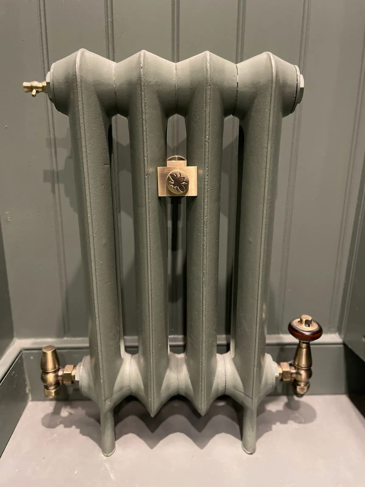 Compact Cast Iron Radiator Installation – Brighton & Hove | AC Plumbers Ltd. Cast iron radiator valve fitting and balancing on a home heating system